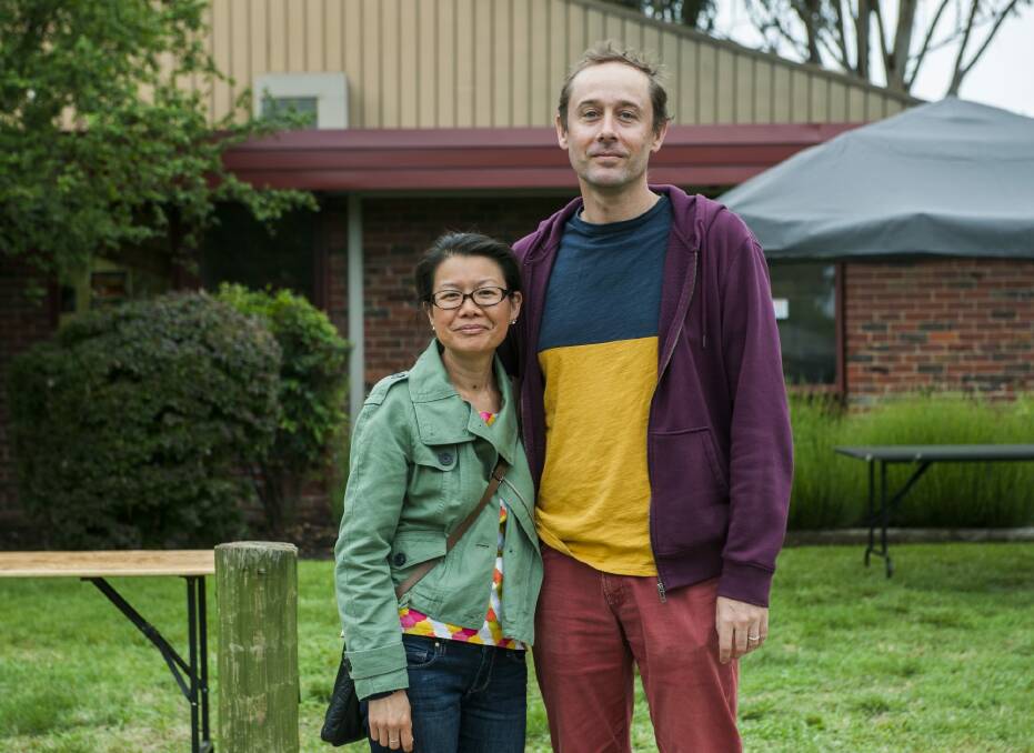 Ling Lee and Peter Barger from Adelaide were anxious with news of Paris' lock down following the attacks whether French community events in Canberra would be cancelled.  Photo: Elesa Kurtz