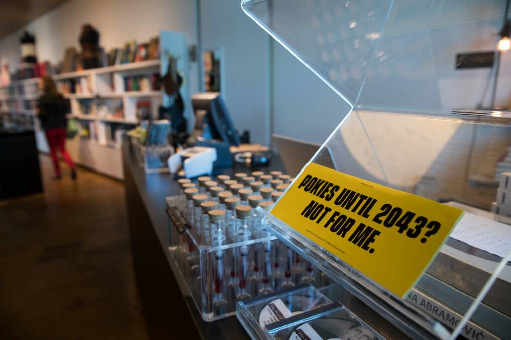 Anti-pokies stickers on display in the shop at MONA.  Photo: Janie Barrett