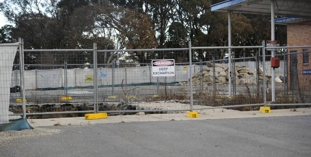 The holes left where the petrol tanks at the Williamsdale service station were removed. The latest bore tests, in 2013, found various petrol contaminants at levels above EPA permitted levels.  Photo: Melissa Adams
