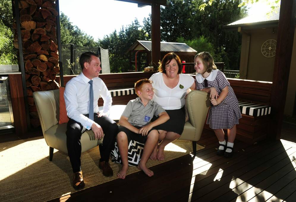 Diplomat Trudy McGowan at home Canberra with her family, from left, Justin, Will,12 and Genevieve,9. She was a primary school teacher before she joined DFAT. Photo: Melissa Adams