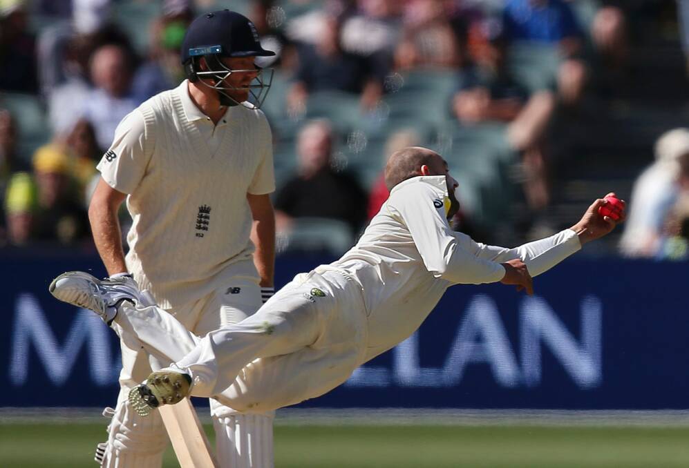 Australia's Nathan Lyon, front, is watched by England's Jonny Bairstow as he catches out England's Moeen Ali off his own bowling during the third day of their Ashes cricket test match in Adelaide, Monday, Dec. 4, 2017. (AP Photo/Rick Rycroft) Photo: RICK RYCROFT