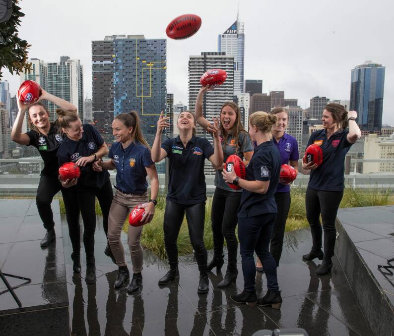 The top eight selections in the first AFL women's draft celebrate in Melbourne on Wednesday. Photo: Jason South