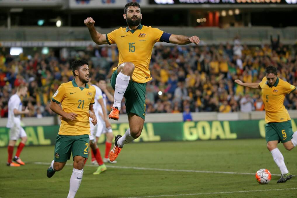 Socceroos captain Mile Jedinak celebrates after scoring at Canberra Stadium in November last year. Photo: Alex Ellinghausen