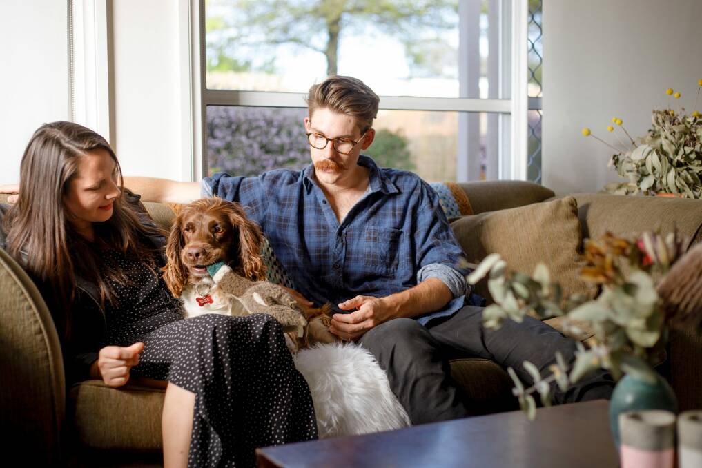 Josh Rae and Silvie Eckhardt with their English springer spaniel Ted.  Photo: Sitthixay Ditthavong