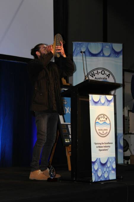 Icon Water employee Sam Bracken does a "shoey'' to celebrate the ACT having better-tasting water than NSW. Photo: Supplied