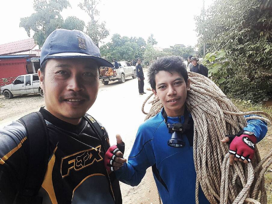 Locals prepare to take the birds' nest team into the mountains in Khun Nam Nang Norm National Park to find alternative ways into the cave. Photo: Supplied