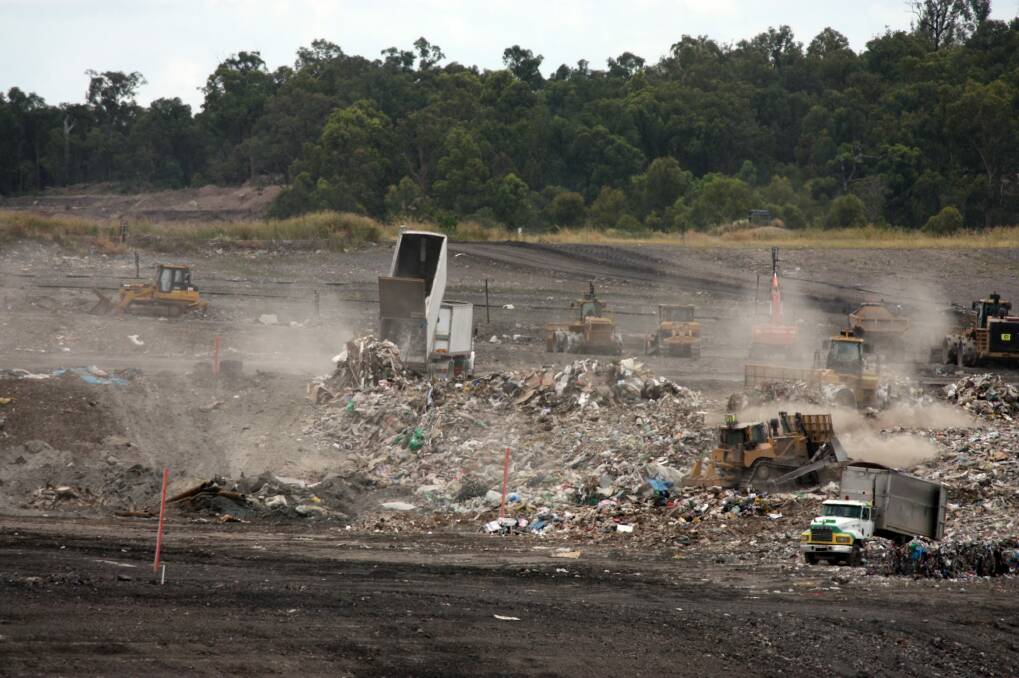 Queensland waste trucks dump unprocessed construction waste from NSW at Cleanaway's New Chum landfill in Ipswich after it has passed through Cleanaway's recycling facility at Willawong in January. Photo: Mark Solomons