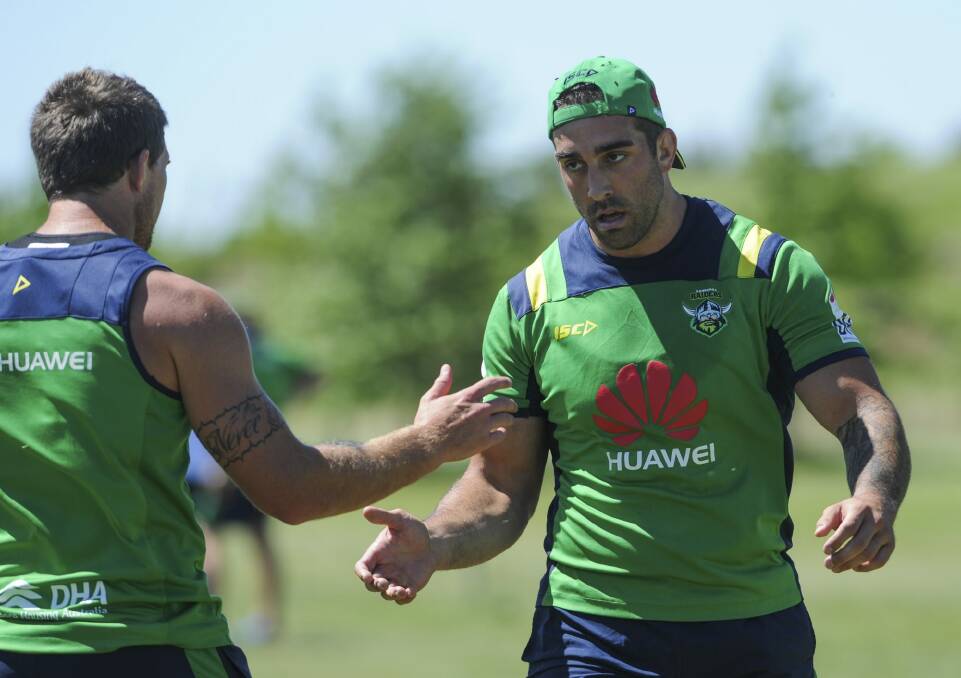 Raiders forwards Jarrad Kennedy (left) and Paul Vaughan take a breather.
 Photo: Graham Tidy