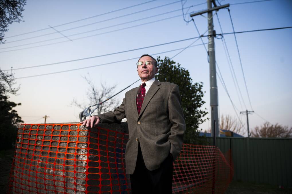 Leo Dobes of the Griffith Narrabundah Community Council with the concrete pillar. Photo: Dion Georgopoulos