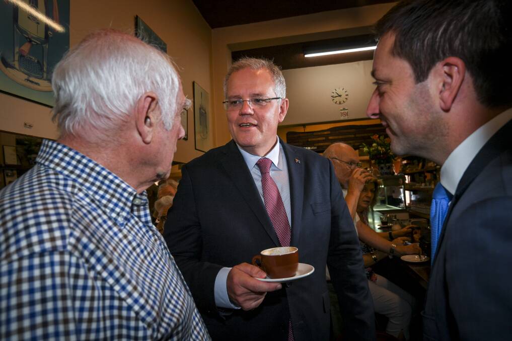 Prime Minister Scott Morrison and Opposition Leader Matthew Guy meet Pellegrini's co-owner Nino Pangrazio.  Photo: Eddie Jim 