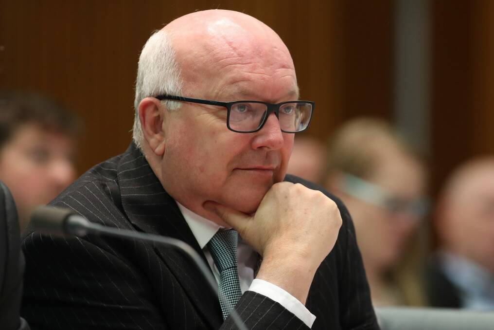 Attorney-General Senator George Brandis said the federal courts were responsible for their own operation. Photo: Andrew Meares