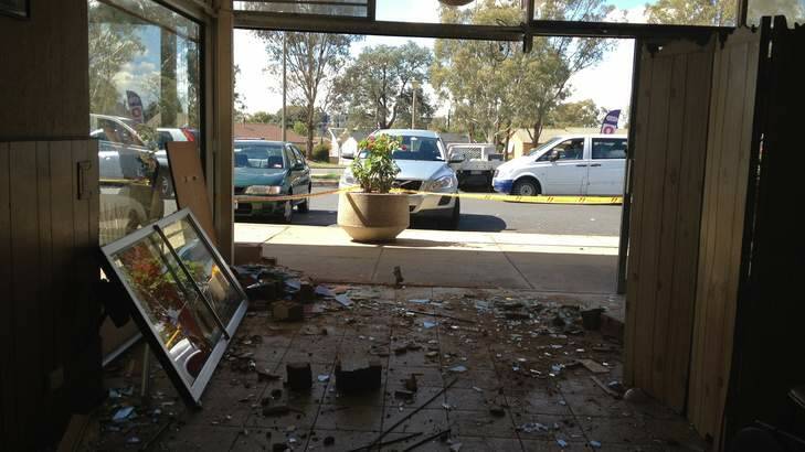 The aftermath of a car crashing into the Macquarie store. Photo: Henry Belot