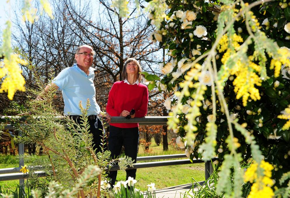 Jeremy and Marguerite Ranicar among the flowers in their garden at Yarralumla. Photo: Melissa Adams
