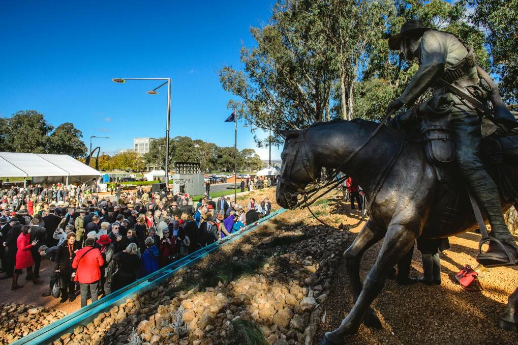 Crowds gather around a new memorial on Anzac Parade commemorating Australia's involvement in the Boer War from 1899 to 1902.  Photo: Sitthixay Ditthavong