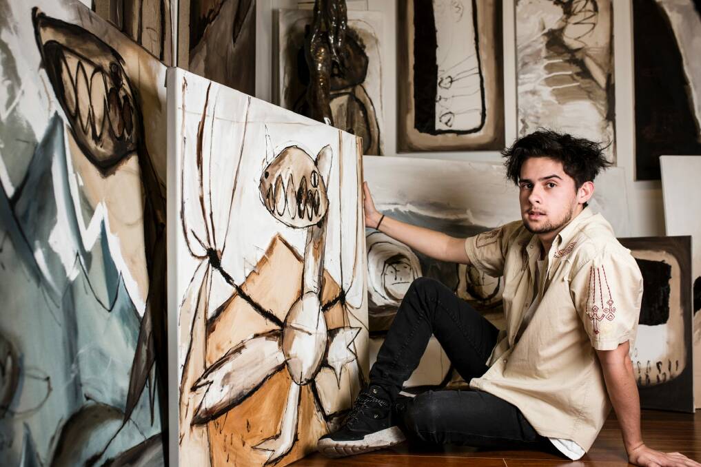 18-year-old Solomon Grainger with works from 'Dragon and Boy'. Photo: Jamila Toderas