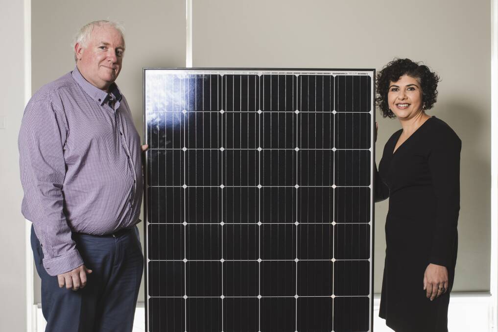 ActewAGL have donated solar panels to Barnardos.
Barnados children's family centre manager Michael Dunne, and Ayesha Razzaq of ActewAGL. Photo: Jamila Toderas.