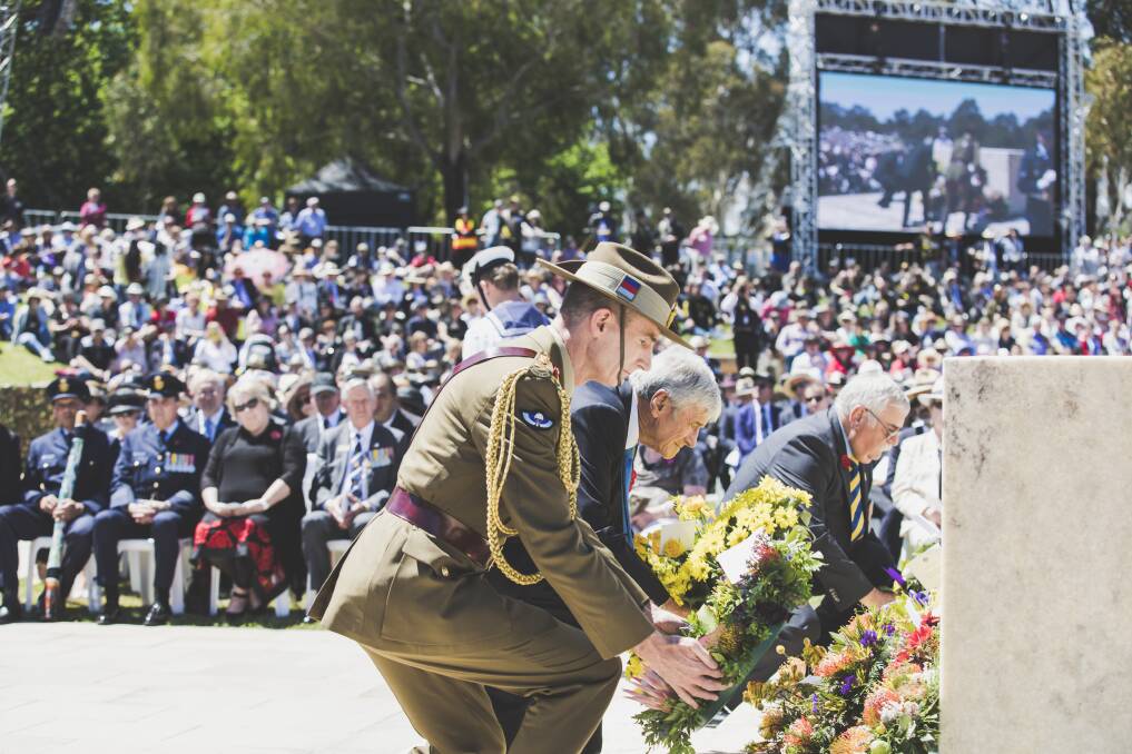 Chief of Defence Force, General Angus Campbell, The Chairman of the Council of the Australian War Memorial Mr Kerry Stokes, and representing the Returned and Services League of Australia Mr John King lay a wreath at the Remembrance Day ceremony Photo: Jamila Toderas