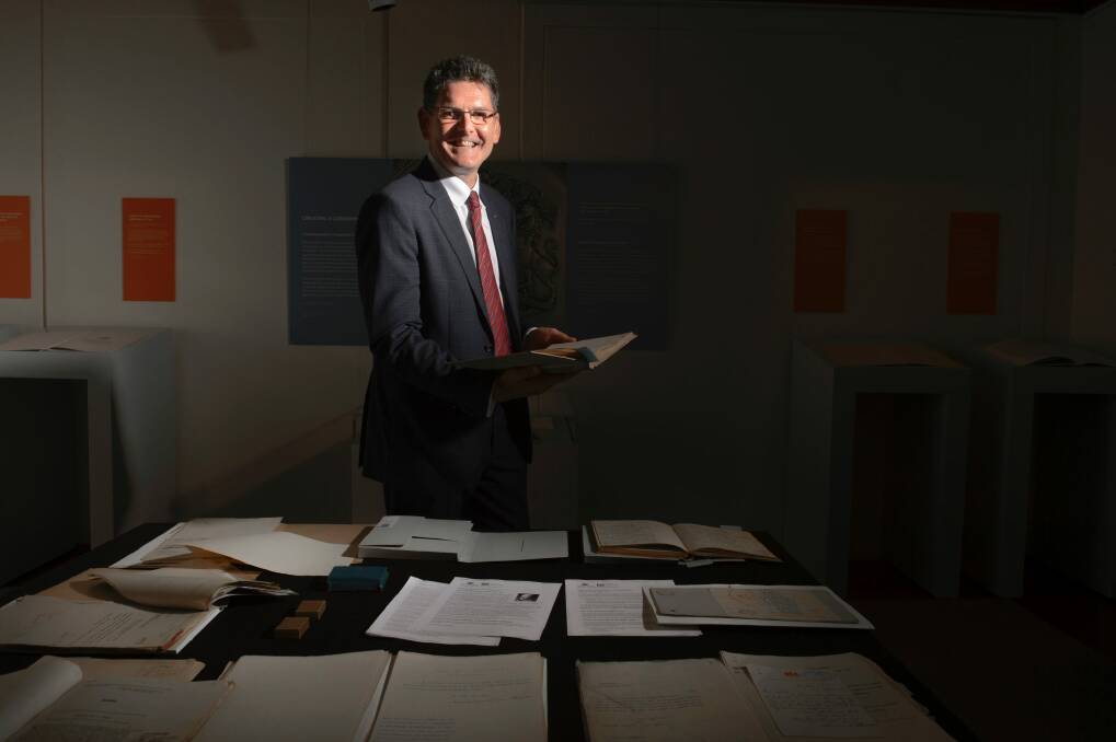 Bill Barton examines records related to his great-grandfather Sir Edmund Barton at Old Parliament House. Photo: Sitthixay Ditthavong