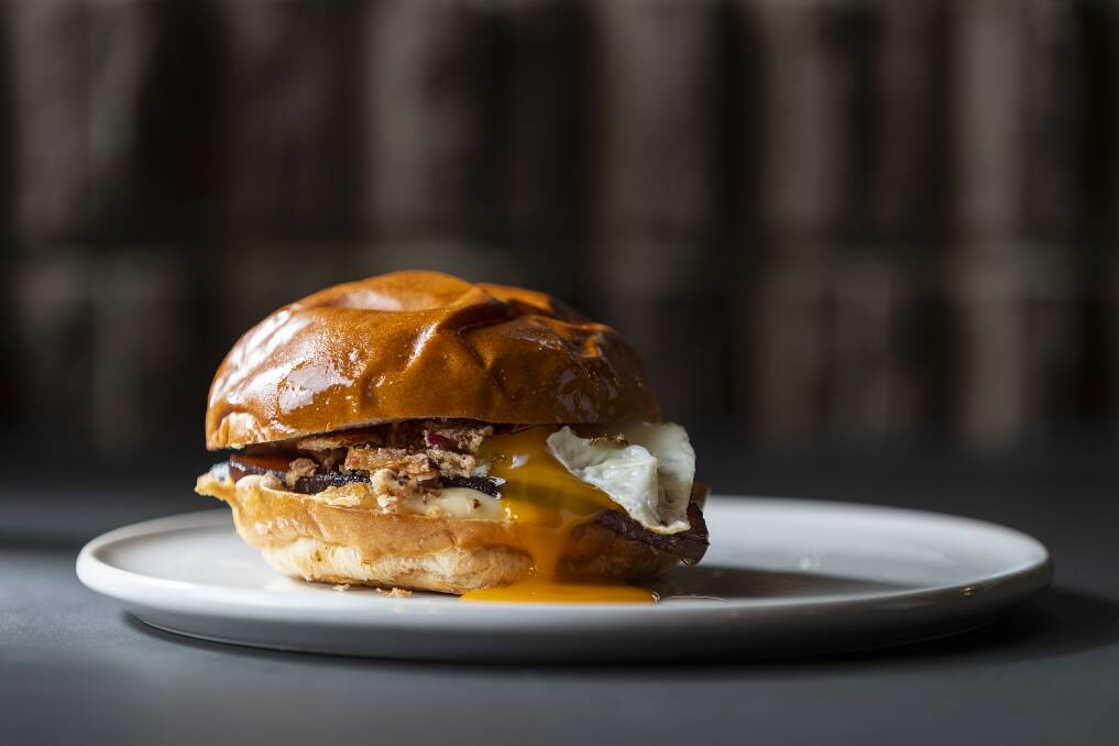 Morning Glory's egg and bacon roll with char sui bacon, egg, fried eschalot and kewpie mayonnaise. Photo: Adam McGrath