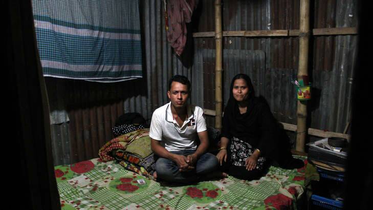 Forhad Mia and his wife Raifa sit in their slum bedsit in the Bangladeshi capital Dhaka. Photo: Ben Doherty