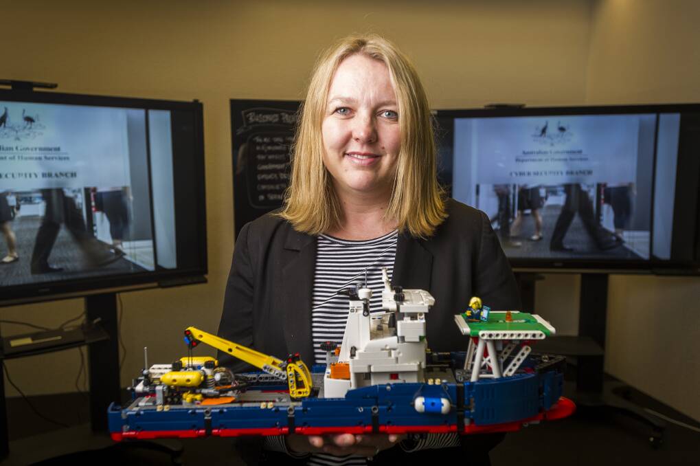 DHS national manager of cyber security Narelle Devine with a lego model used in the cyber war games last year. Photo: Dion Georgopoulos