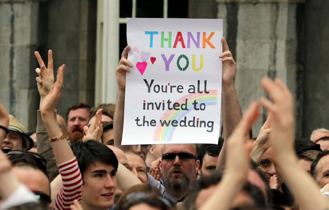 A supporter holds a sign during celebrations of the vote to legalise same-sex marriage in Ireland. Photo: AFP