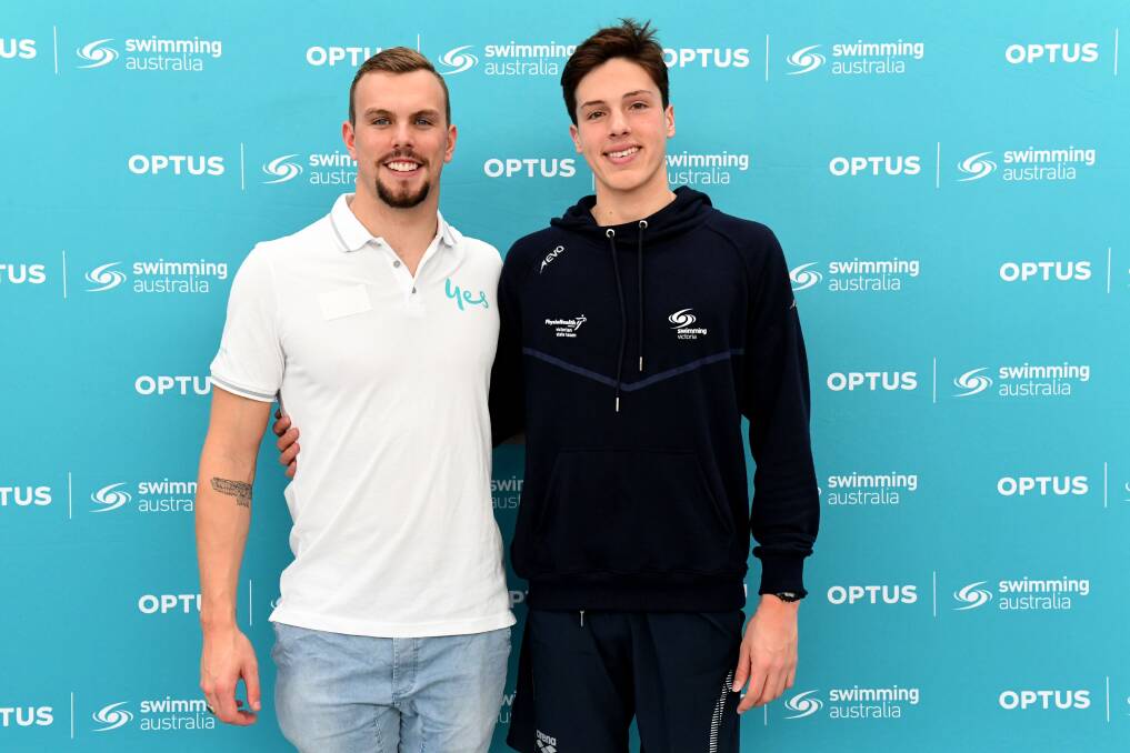 Kyle Chalmers with teenager Noah Millard at the AIS on Friday. Photo: Swimming Australia