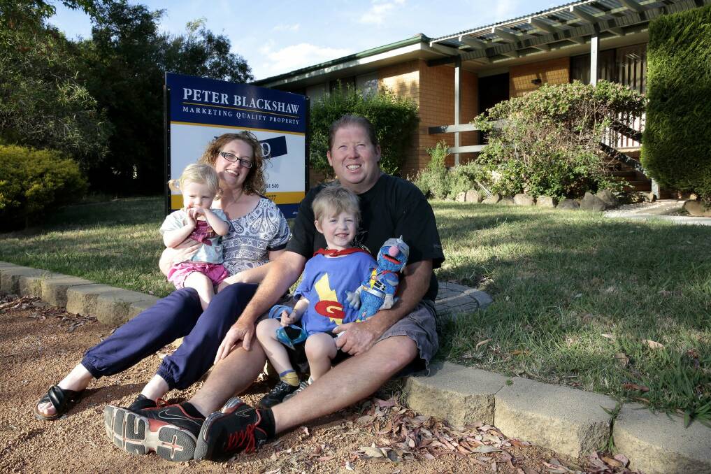 Chris Sims and Charmaine Sims with their son Zac Sims 3 and daughter Alma 20 months are moving on from Mr Fluffy after buying a new home in Kambah.  Photo: Jeffrey Chan