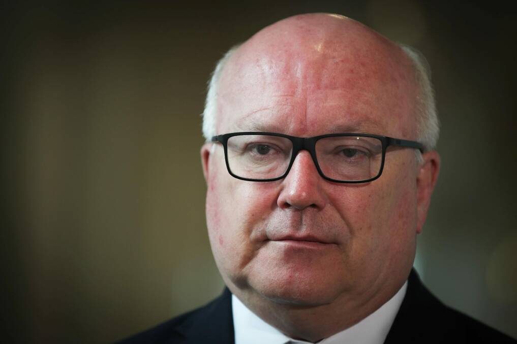 Attorney-General George Brandis will introduce new laws that crack down on foreign interference in Australian politics. Photo: Alex Ellinghausen