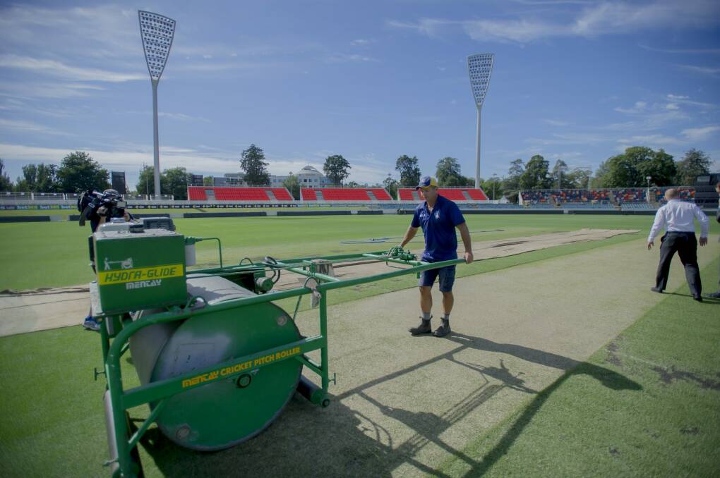 The Manuka Oval pitch gets its final touches before Wednesday's one day international match by curator Brad Van Dam. Photo: Karleen Minney