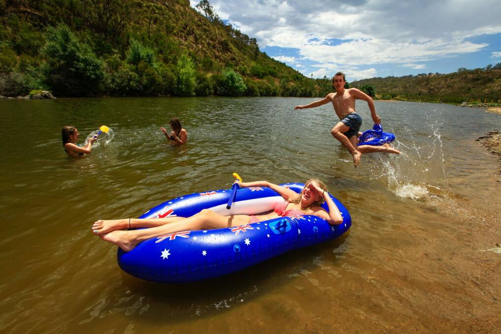 Canberrans cooling off in the Murrumbidgee River. Photo: Katherine Griffiths