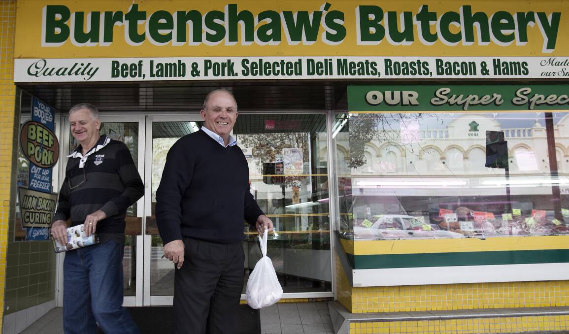 John Williams outside the local butcher shop and his electoral office in Inverell in 2014.  Photo: Louie Douvis