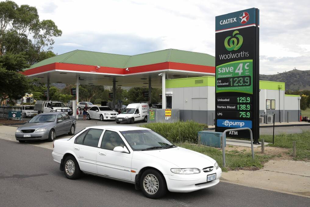 Filling up: Petrol prices at the Lanyon Marketplace Woolworths. Photo: Jeffrey Chan