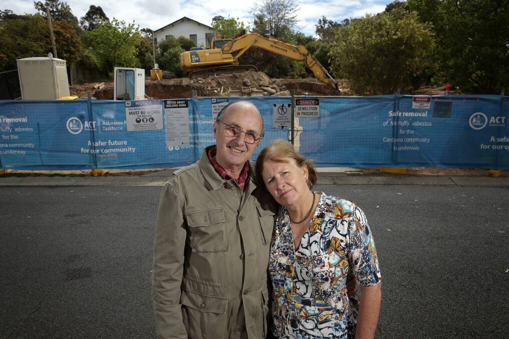 Ron and Wendy White in front of their former home in Chapman.  The Mr Fluffy home has been decontaminated and was demolished over the past week.    Photo: Jeffrey Chan