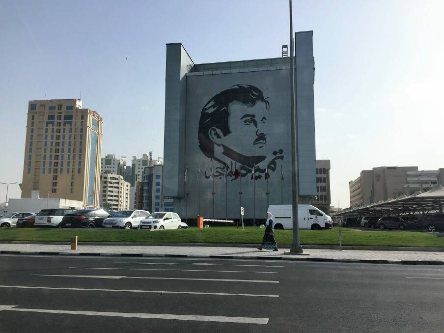 The face of the Emir on a building in Doha, Qatar. Qatari are showing solidarity with the government for withstanding the pressure of the blockade.  Photo: Katie Burgess