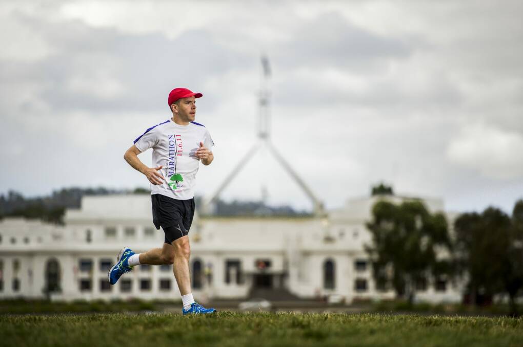 Grueling task: Ed Wilkinson, 37, is running from Canberra to Sydney to raise money for children with heart disease. Photo: Jay Cronan