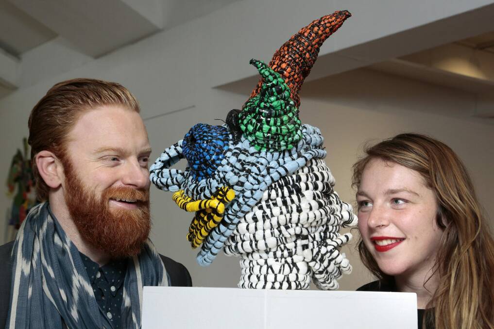 Program manager Alexander Boynes and gallery manager Sabrina Baker with a "selfie" piece by Ann McMahon at the Canberra Contemporary Art Space. Photo: Jeffrey Chan