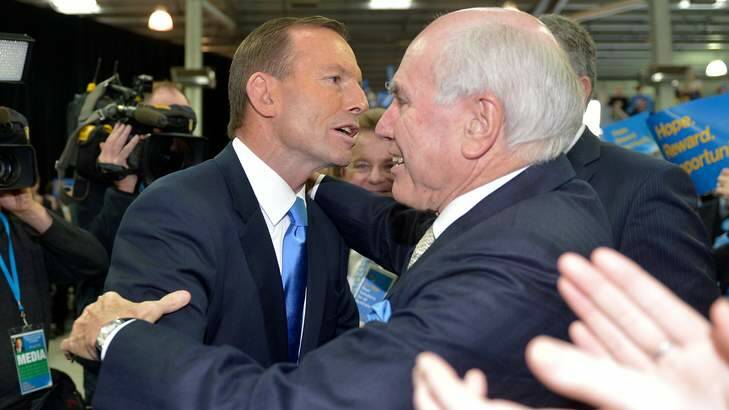 Tony Abbott with his political mentor John Howard at the Melbourne Showgrounds during the election campaign last June. Photo: Joe Armao