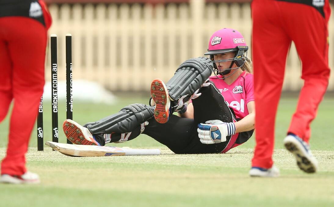 Down and out: Ellyse Perry has been ruled out of Wednesday's semi-final at the Gabba after suffering a hamstring injury. Photo: Mark Metcalfe