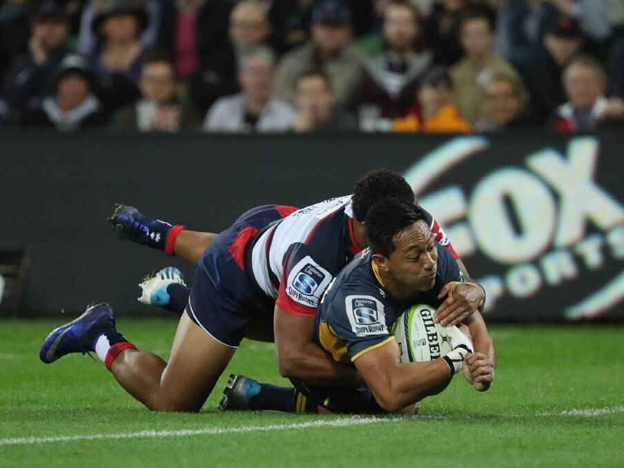 Over he goes: Christian Lealiifano touches down for the Brumbies. Photo: Getty Images