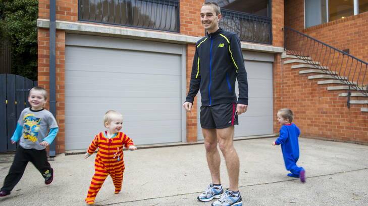 Australian Olympic marathon runner Martin Dent reckons the Olympic Village isn't dissimilar to raising his three young boys, Elye, Connor, and Hayden. Photo: ROHAN THOMSON