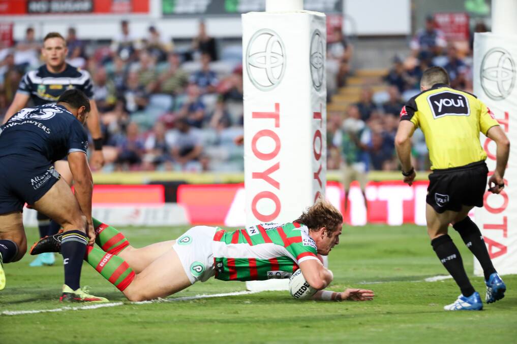 Off the mark: George Burgess scores an early try for the Rabbitohs. Photo: AAP
