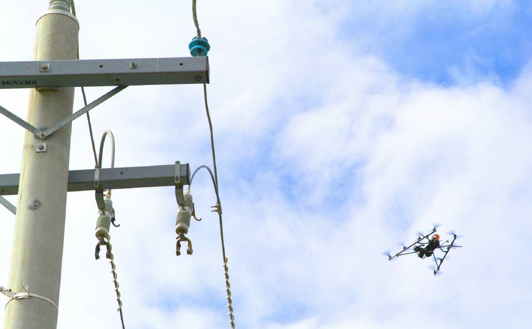 ActewAGL inspects powerlines in Greenway, Canberra, during their trial of drone technology Photo: Clare Ross