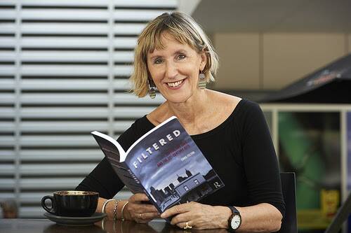 Dr Emma Felton with her recently published book Filtered: Coffee, the cafe and the 21st century City. Photo: Supplied