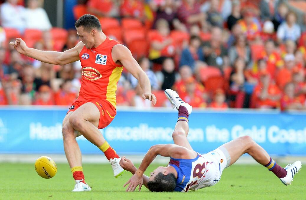 Tom Rockliff of the Lions is knocked out after colliding with Steven May. Photo: Getty Images