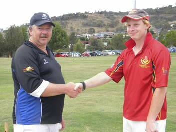 Peter Foley shakes hands with his 1000th victim Will Thomson.