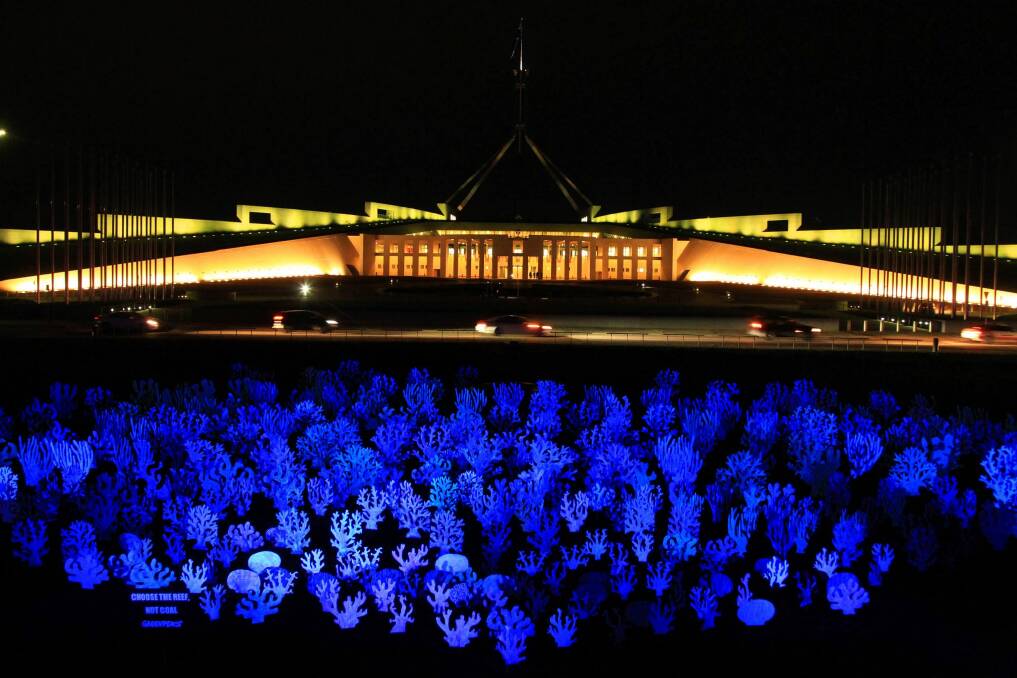 Coral reef cutouts were placed on the Parliament House lawn by Greenpeace Australia Pacific activists. Photo: Dean Sewell