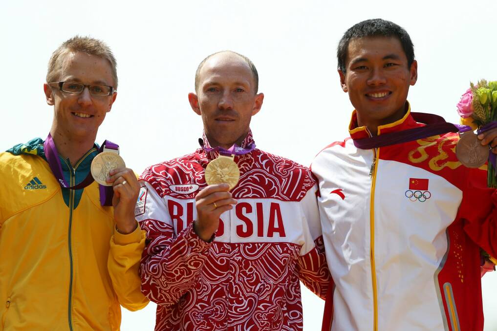 Australian silver medallist Jared Tallent besides Russian gold medallist Sergey Kirdyapkin and bronze medallist Tianfeng Si of China during the medal ceremony for the Men's 50km Walk at the 2012 London Olympics. Photo: Streeter Lecka