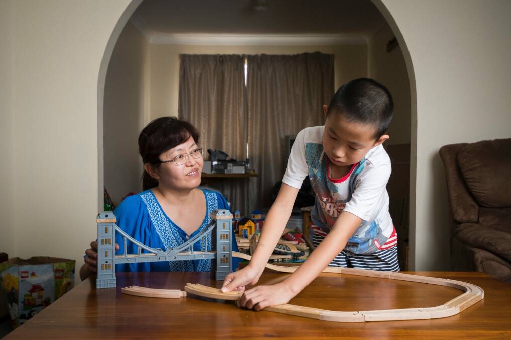 Nancy Ju and Allan Liang, 9, in their Chisholm home. Photo: Dion Georgopoulos