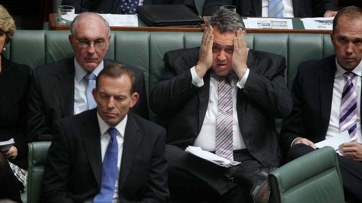 Opposition treasury spokesman Joe Hockey, with his head in his hands, reacts during question time in Federal Parliament yesterday. Photo: Alex Ellinghausen